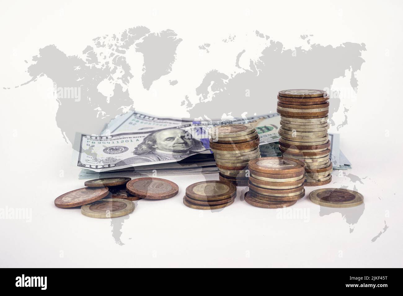 Coin stacks on world map surface. Banknotes and coins. World finance ...
