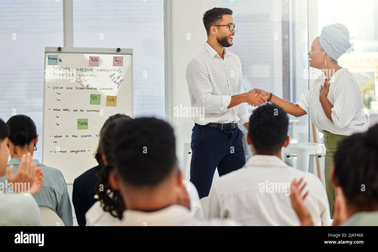 Getting Applause She deserves all the applause shes getting. two young businesspeople ...