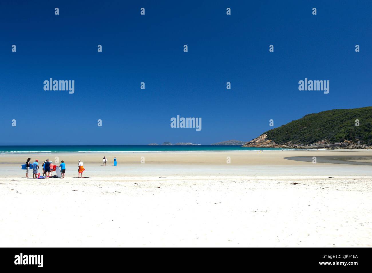 School holidays are over - and these lucky few are enjoying a party on the deserted white sands of Norman Beach at Tidal Inlet on Wilsons Prom. Stock Photo