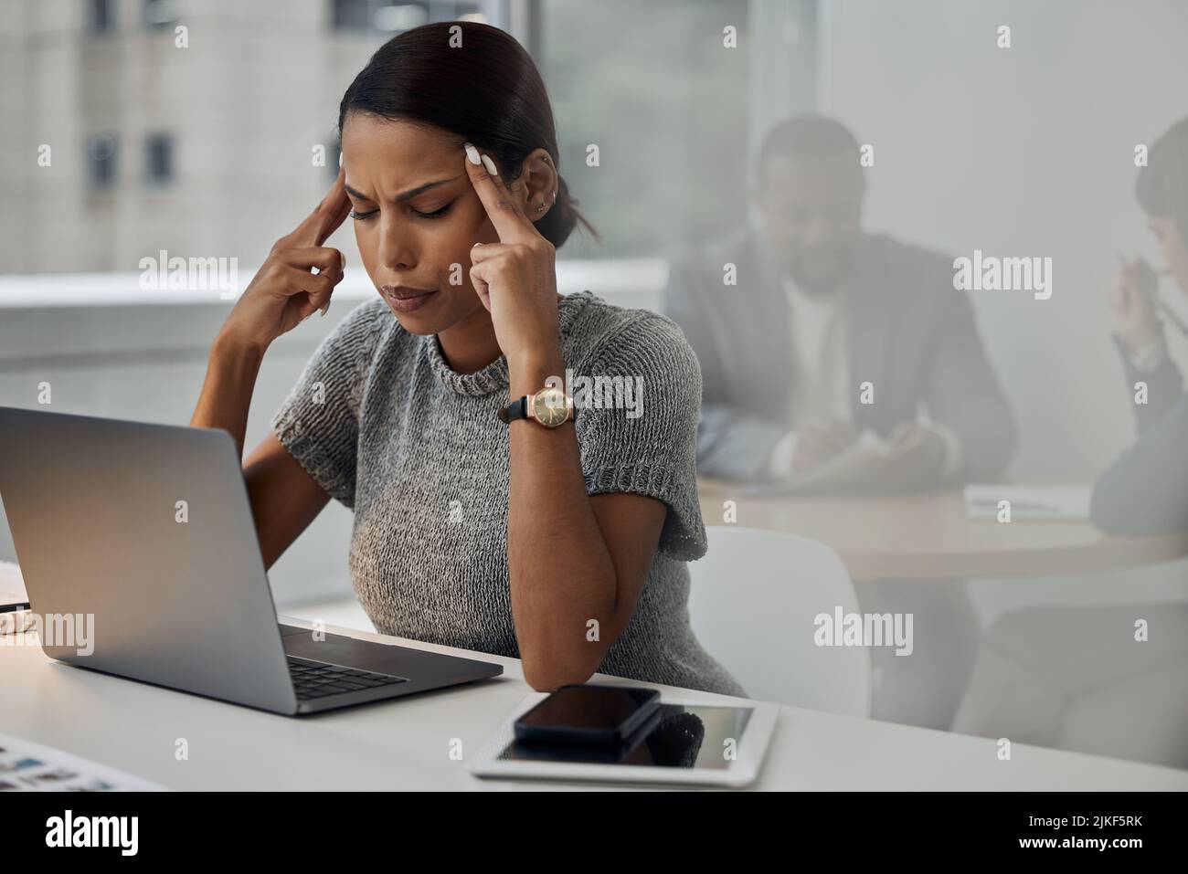 Ive been working for too long. a young businesswoman experiencing a ...