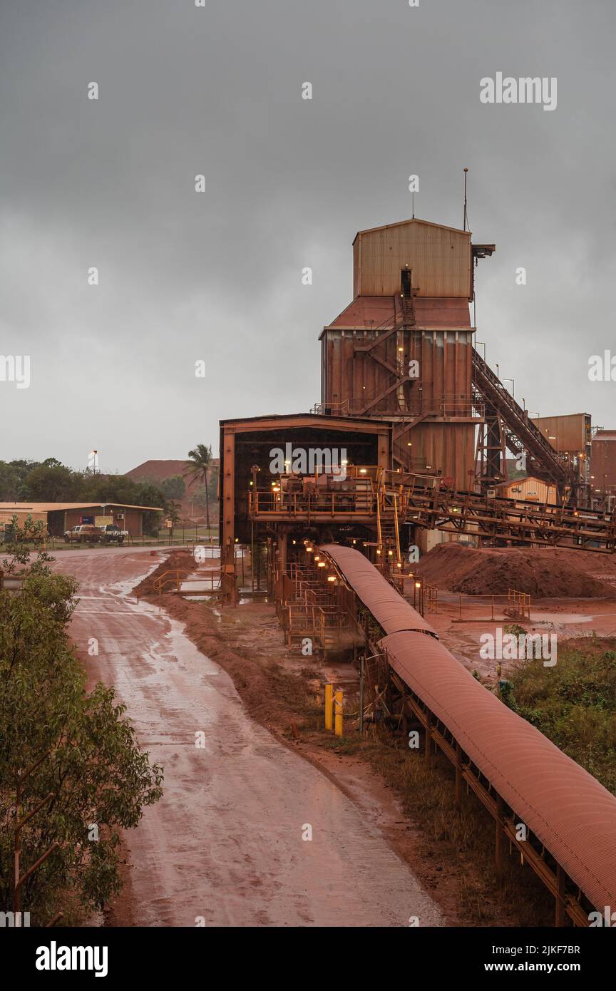 Wet weather highlights the red-orange dust covering the bauxite refinery Nhulunbuy on the Gove Peninsula in the Northern Territory's Australia. Stock Photo