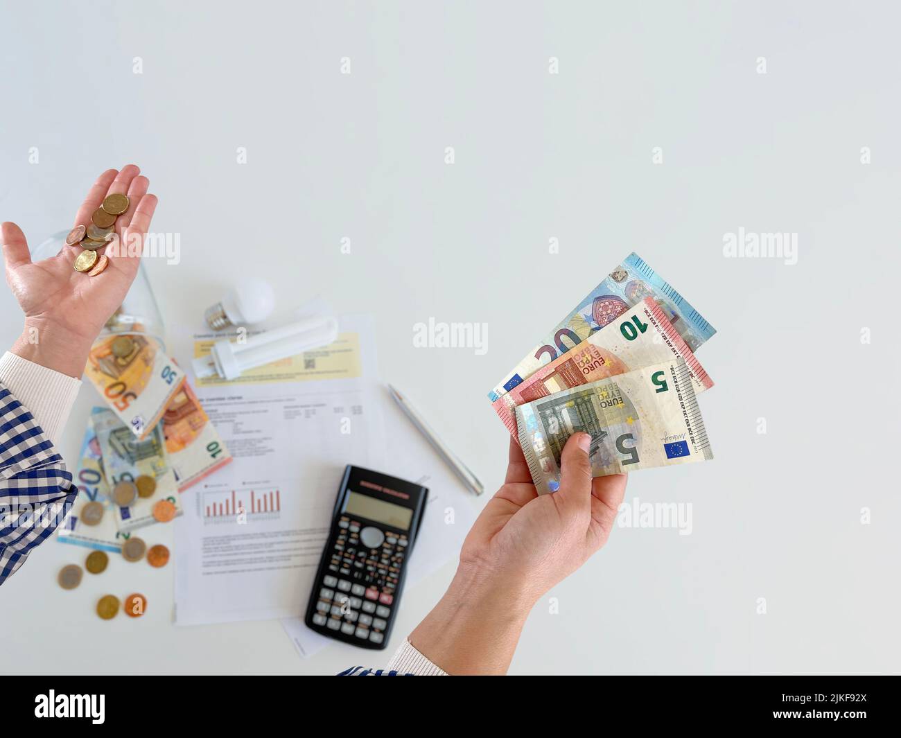 The price of electricity, detail of the electricity bill with money and light bulb - stock photo Stock Photo