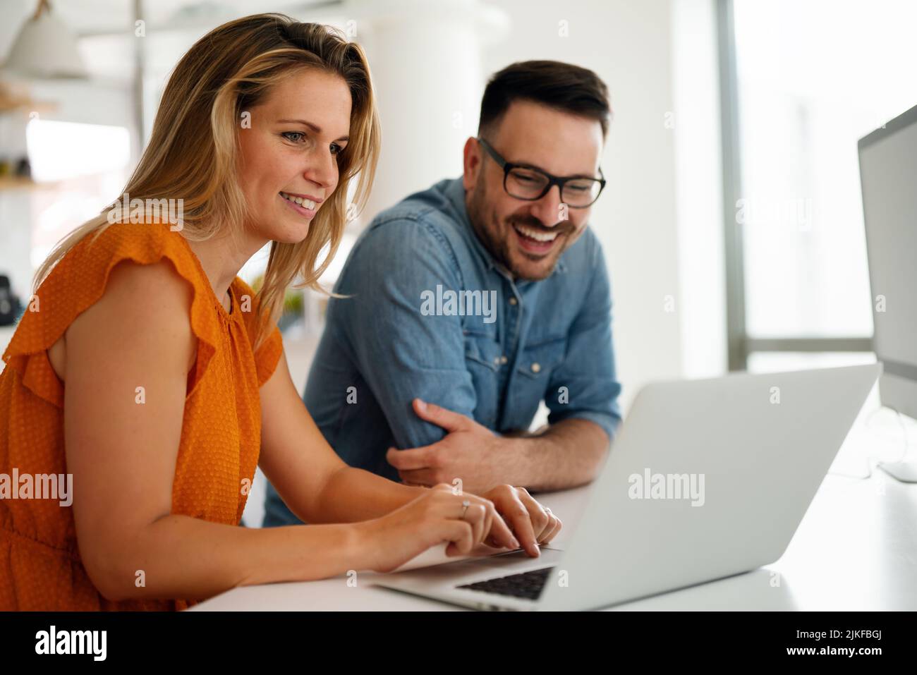 Programmers cooperating at IT company developing apps Stock Photo