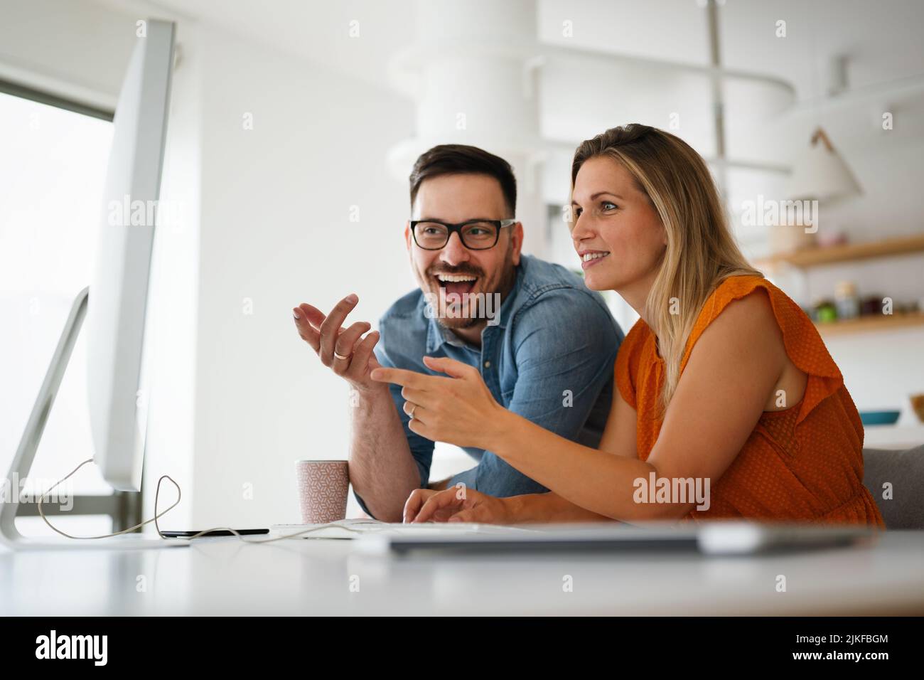 Programmers cooperating at IT company developing apps Stock Photo
