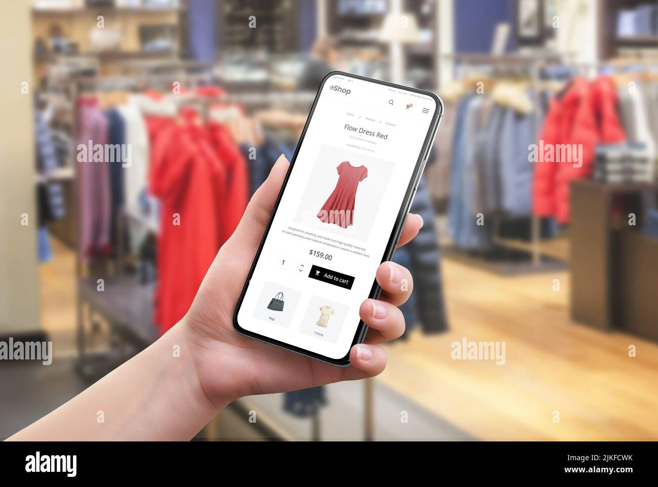 Search for clothes online in a clothing store. Color and size selection on app. Modern e-commerce website on a mobile phone in a woman's hand Stock Photo