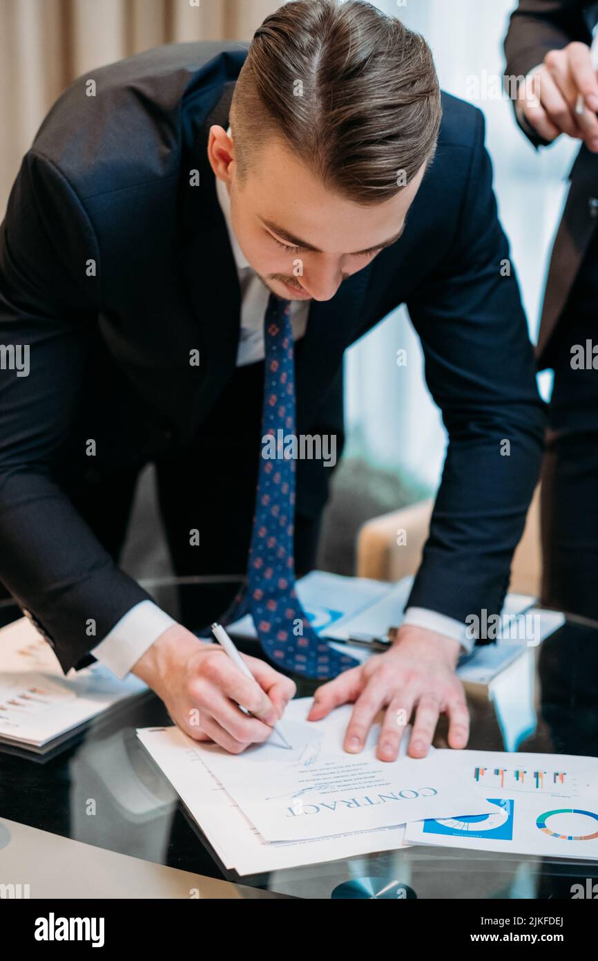 man sign contract business partner deal closing Stock Photo - Alamy