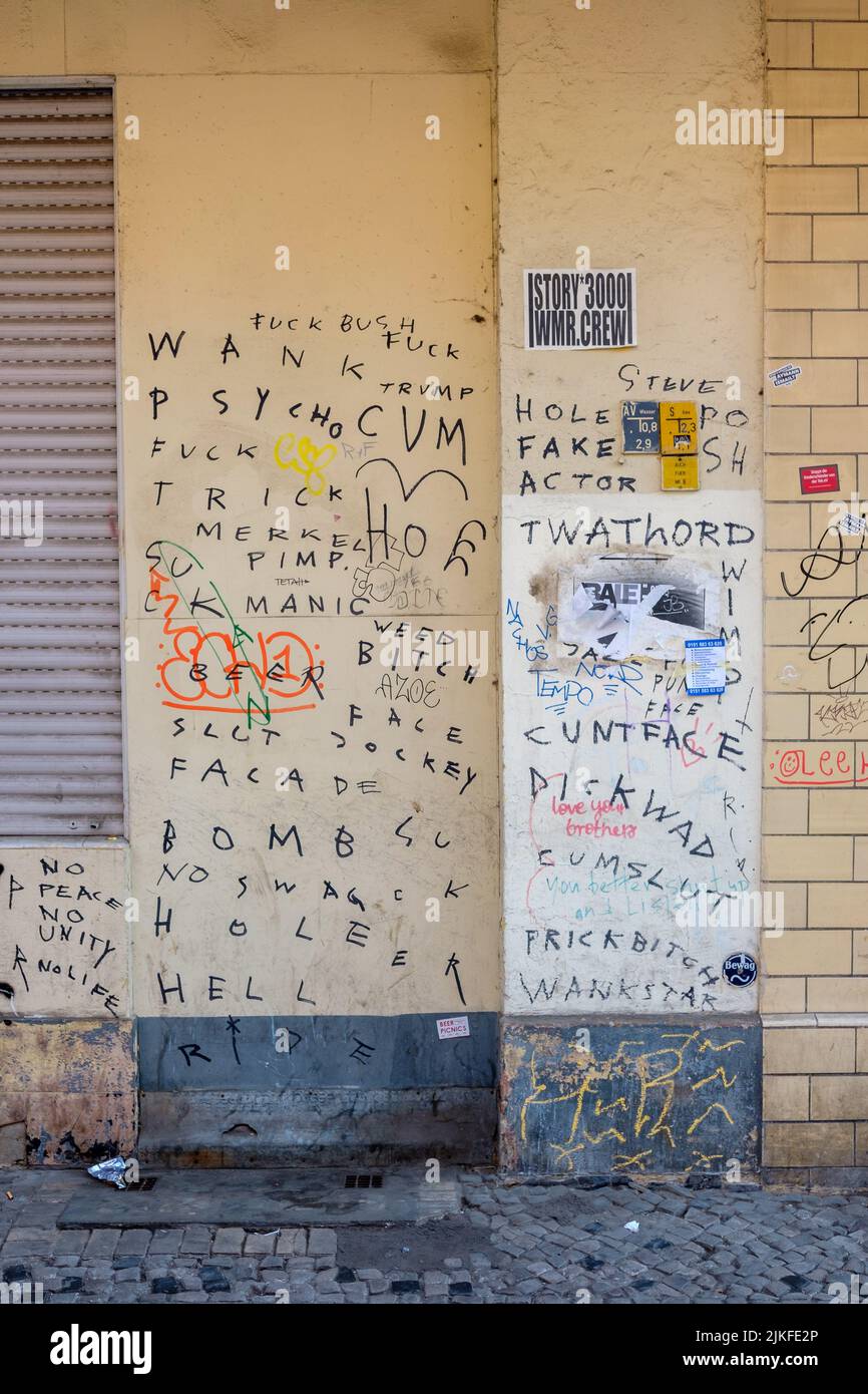 BERLIN, GERMANY - APRIL 6, 2019: Berlin wall covered in expletives scrawled on it in marker in Berlin, Germany on April 6, 2019. Stock Photo