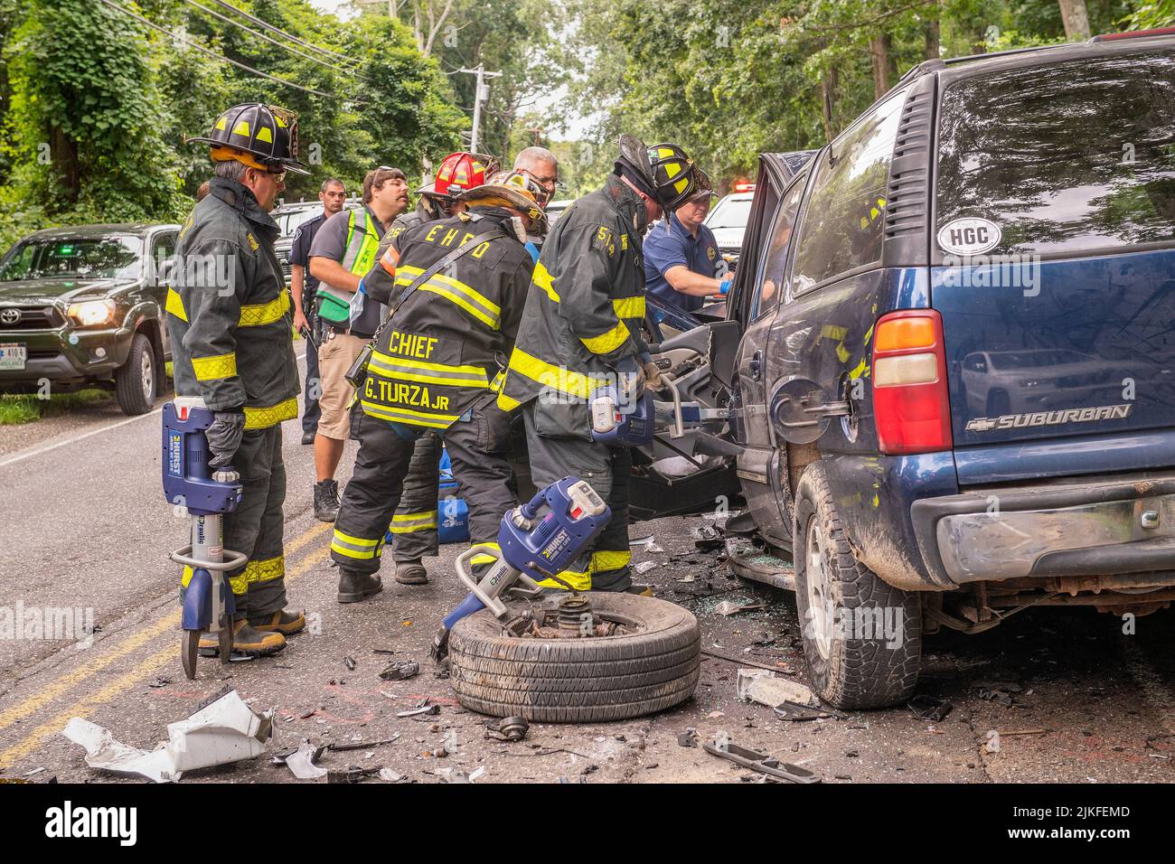 Members of the East Hampton Fire Department's 'White Knights' Heavy Rescue Squad extricated a driver from one of two vehicles involved in a near-head- Stock Photo