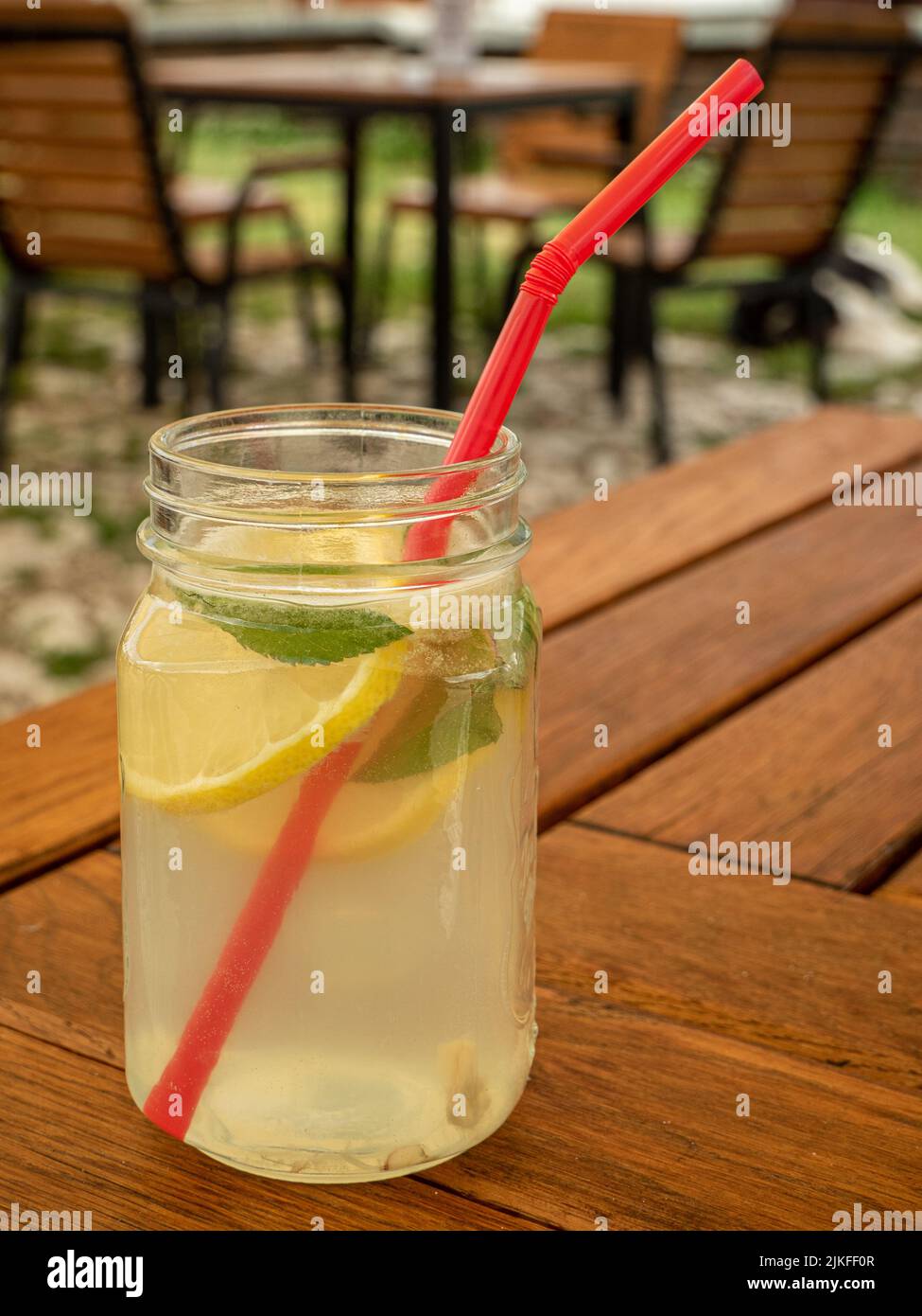 jar with homemade refreshing summer lemonade drink on table Stock Photo
