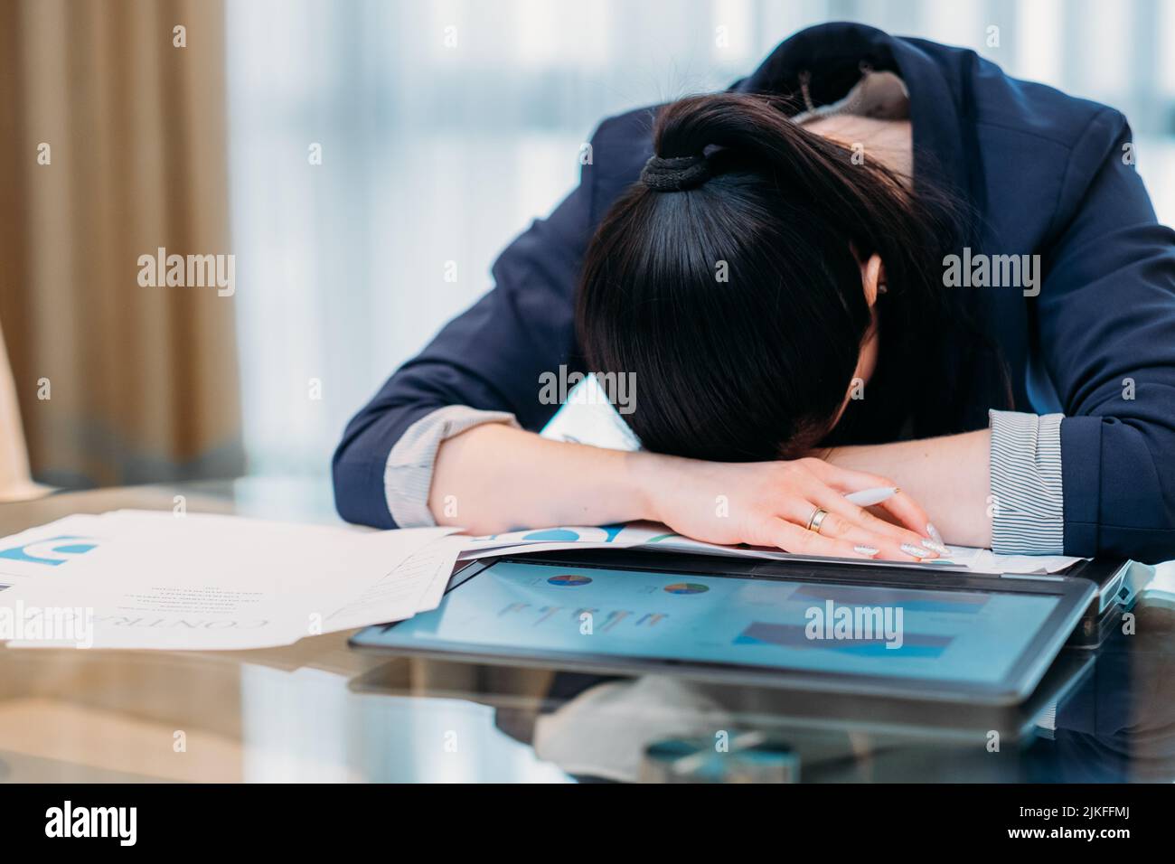 working long hours business overworked tired woman Stock Photo