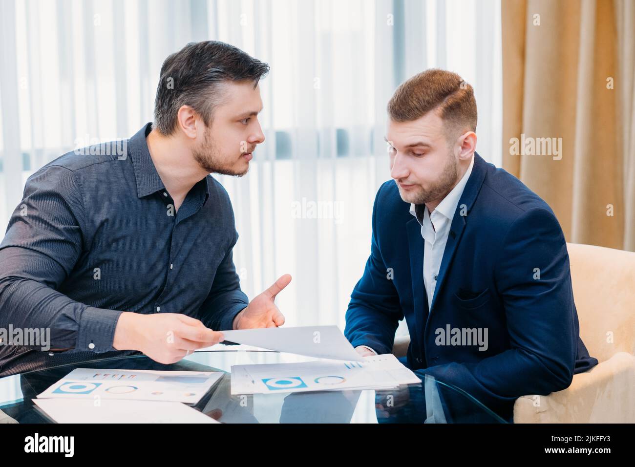 business miscommunication boss not convinced Stock Photo