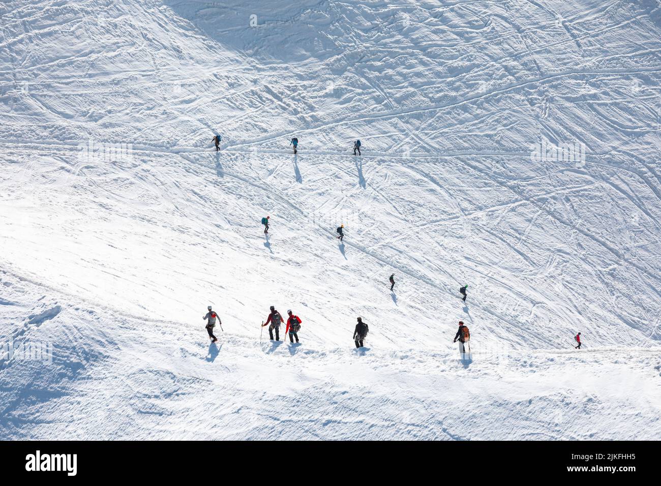Ski climbers descending from the summit of Aiguille du Midi in Mont ...