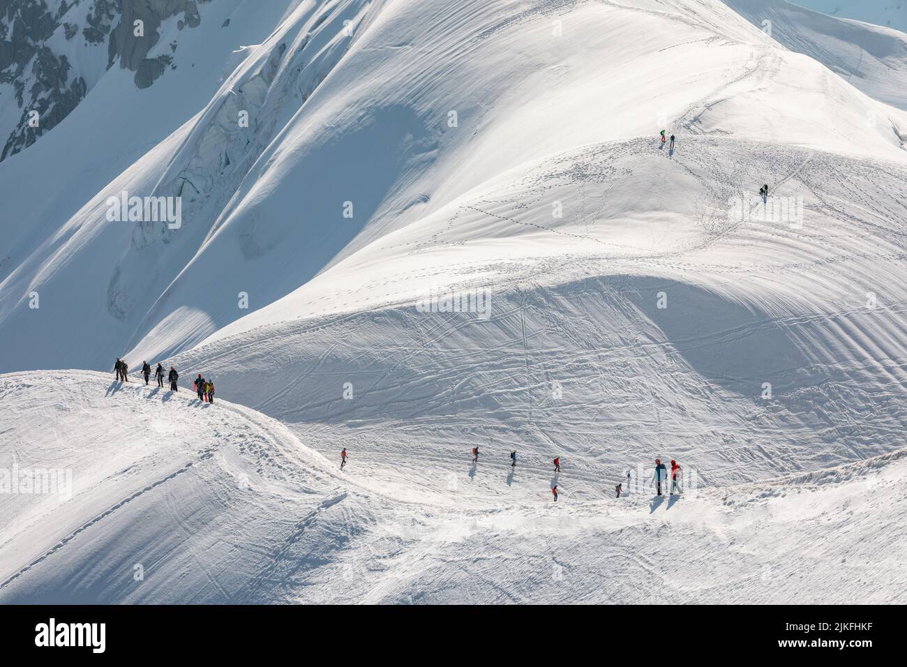 Ski climbers descending from the summit of Aiguille du Midi in Mont ...