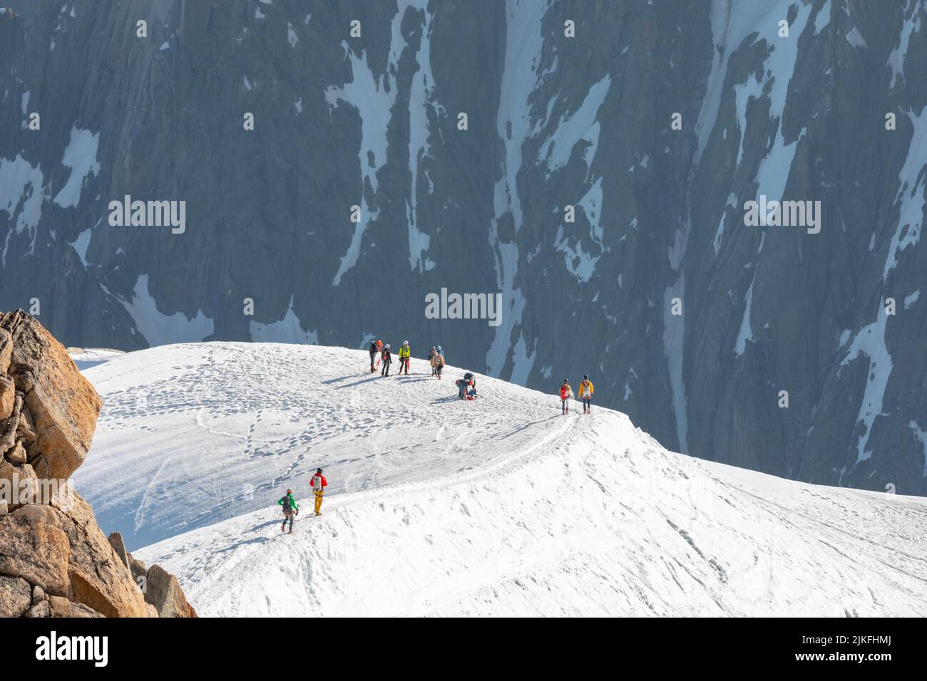 Ski climbers descending from the summit of Aiguille du Midi in Mont ...