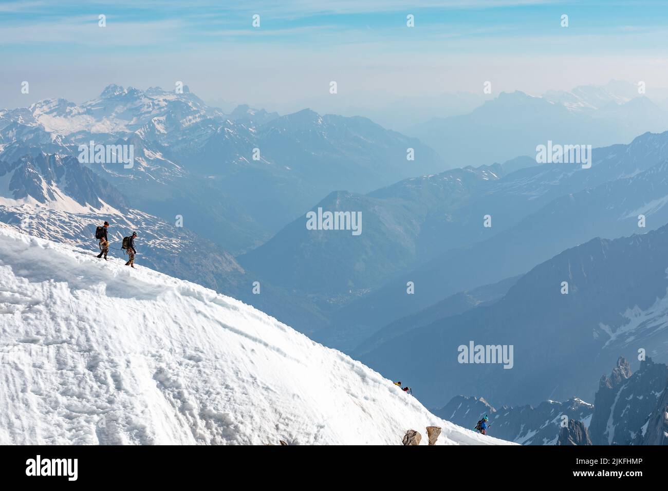 Ski climbers descending from the summit of Aiguille du Midi in Mont ...