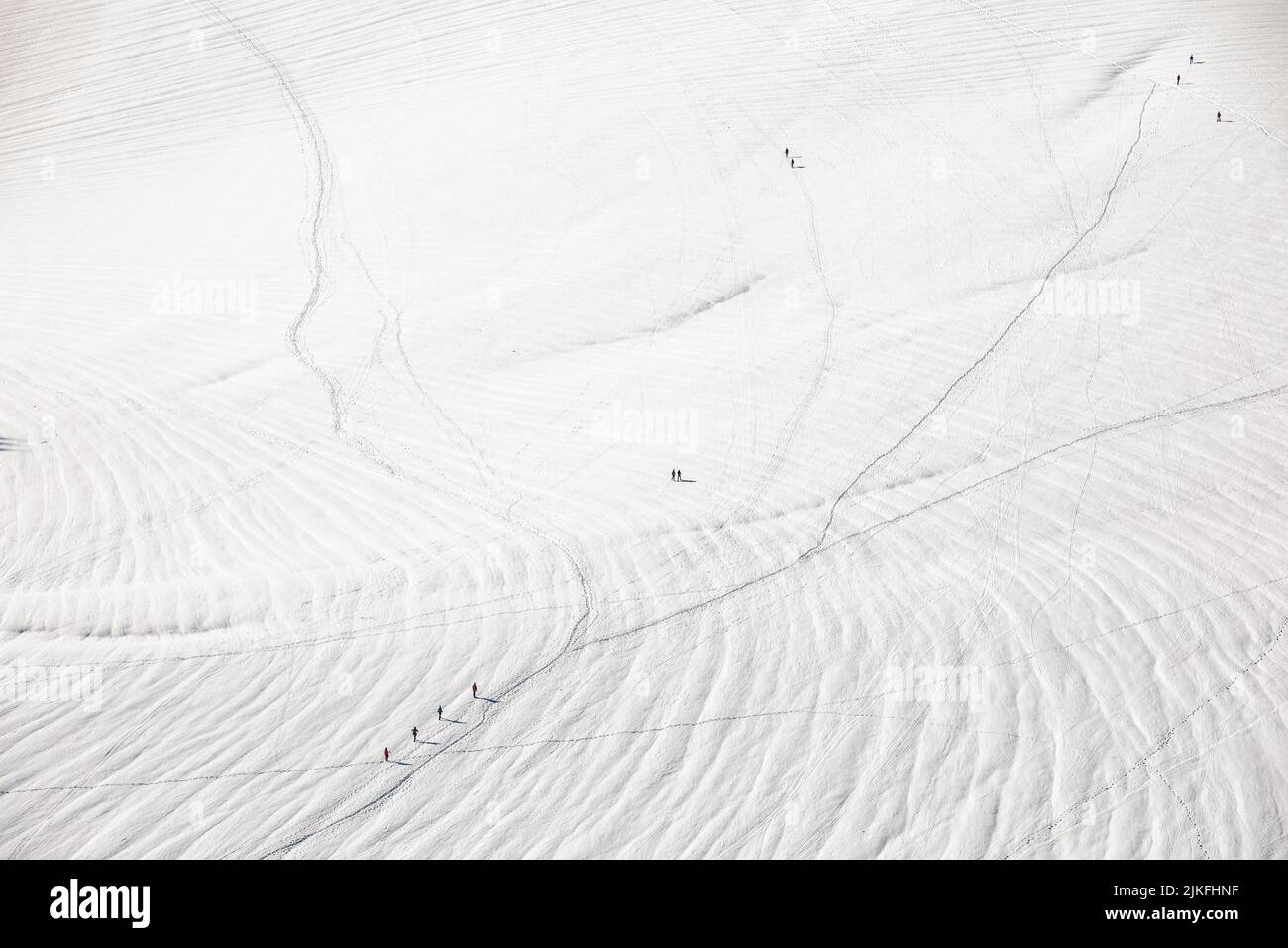 Skiers descending from the summit of Aiguille du Midi in Mont Blanc ...