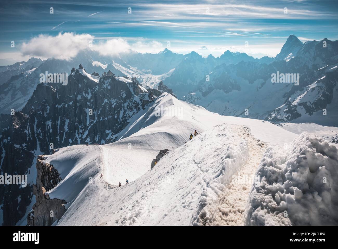 Skiers descending from the summit of Aiguille du Midi in Mont Blanc ...