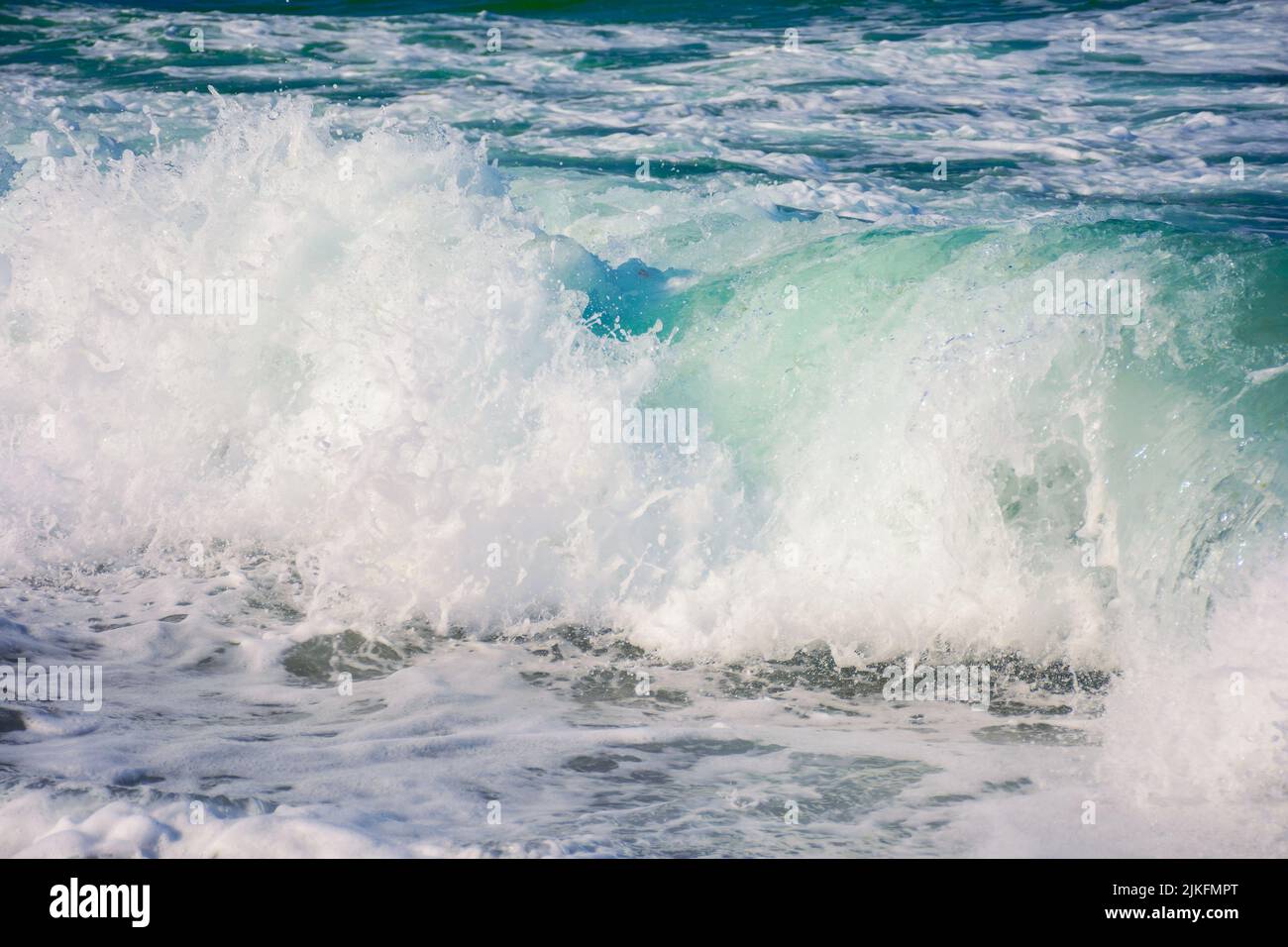 wave rushing in the shore. nature background at the sea in evening light. summer vacation concept Stock Photo