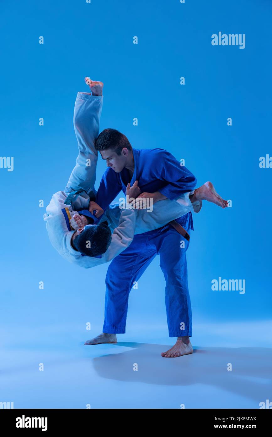 A Man, In A Black Kimono Is Practicing Martial Arts Technique With A Long  Bamboo Fighting Stick. Stock Photo, Picture and Royalty Free Image. Image  91980191.