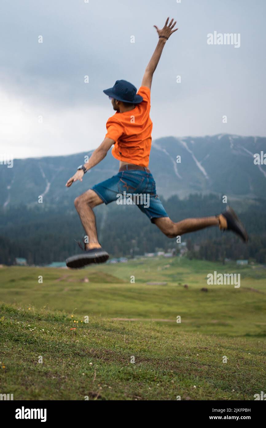 Person jumping in air, Gulmarg, Jammu and Kashmir, India. Stock Photo