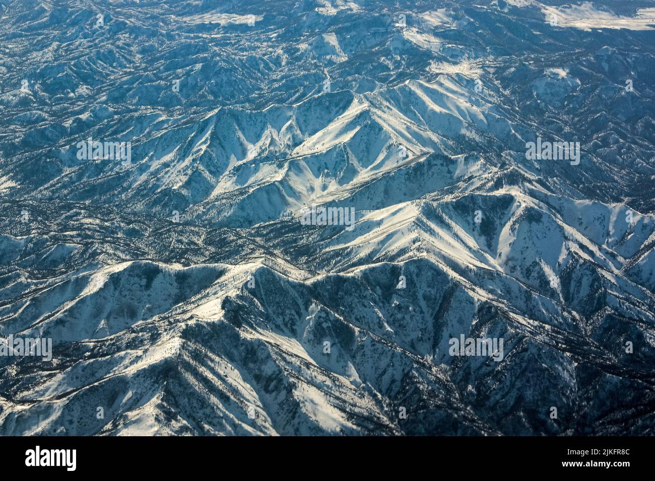 An aerial view of snowy mountains Stock Photo