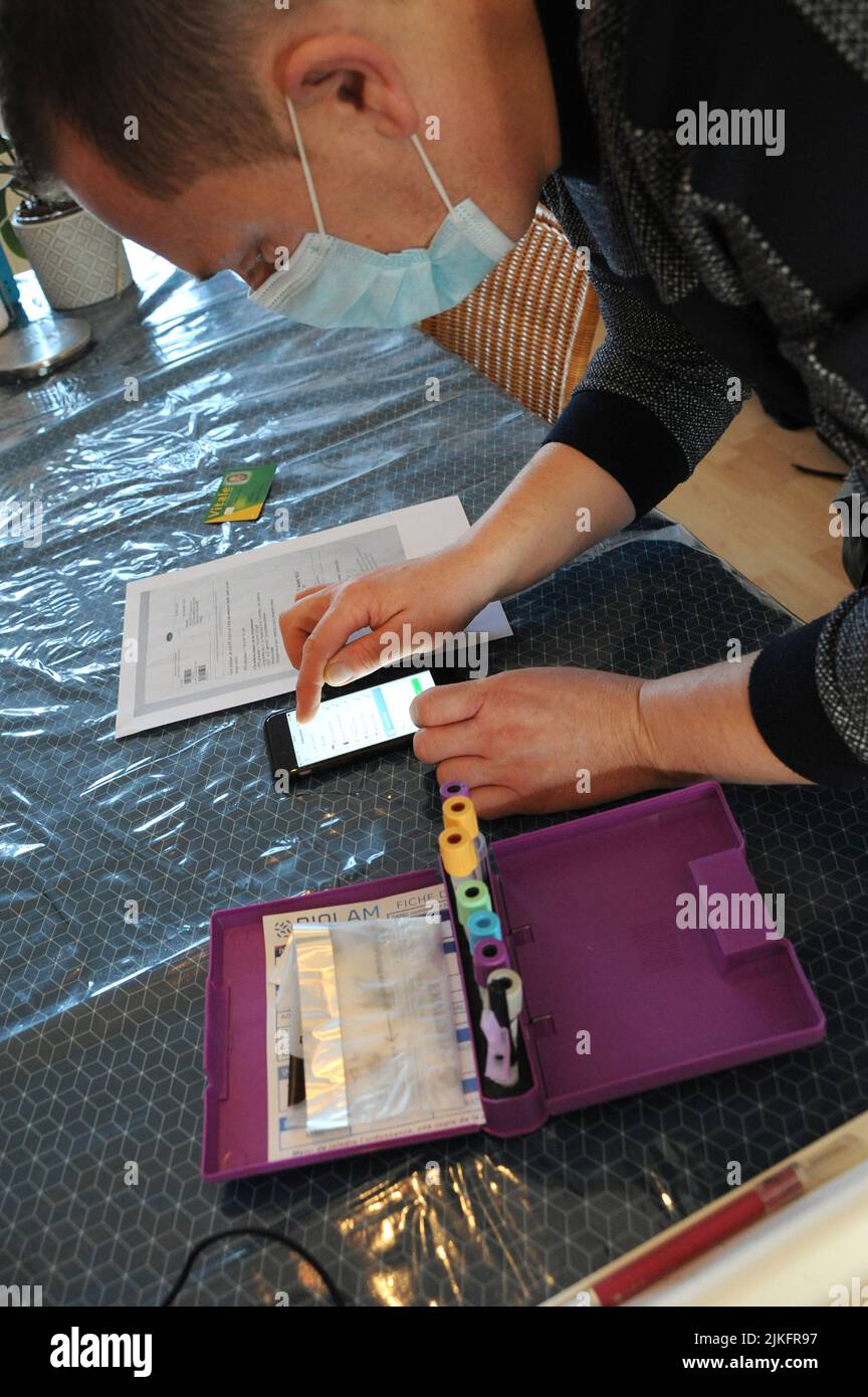 Blood test from a 9-year-old child with soft tissue cancer. Transmission of patient details to the laboratory Stock Photo