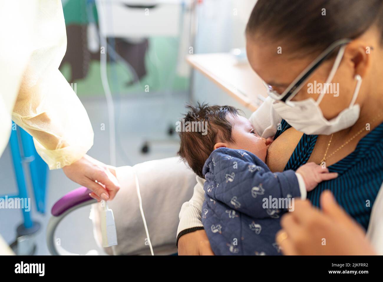 Bronchiolitis epidemic in pediatrics, mother and son in hospital. Stock Photo