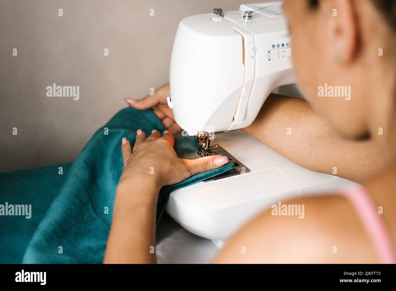 Close-up of a fashion designer sewing machine stitching fabric Stock Photo