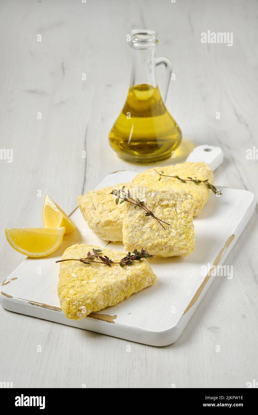 Semifinished frozen fish patty in breading for quick cooking Stock