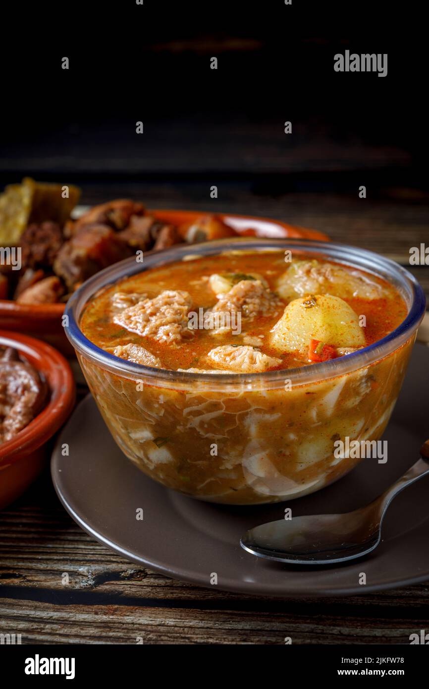 Colombian traditional tripe soup in a glass bowl on wooden table Stock ...
