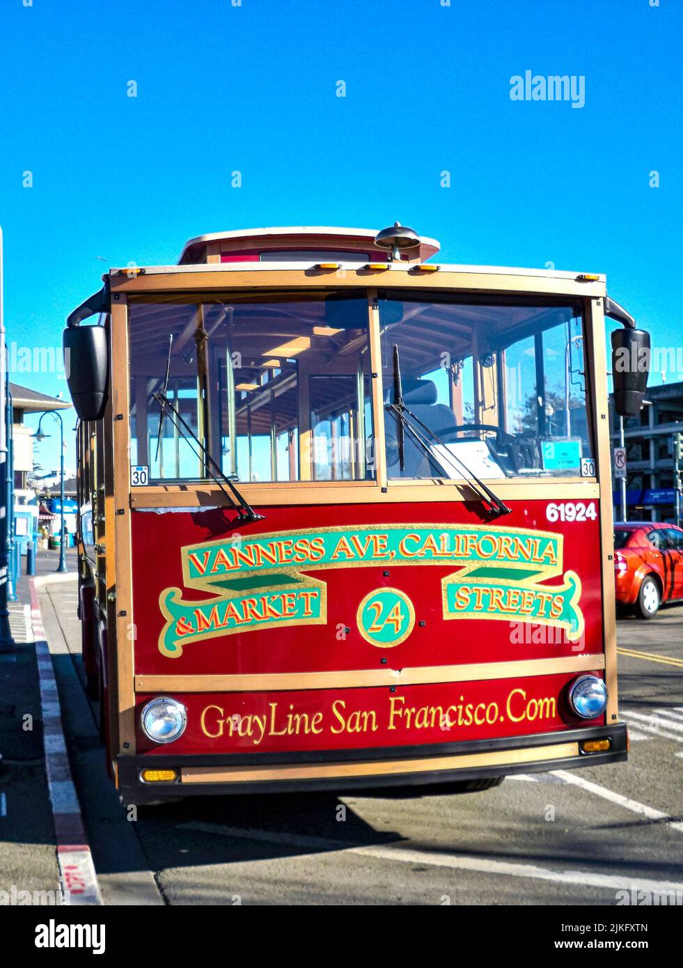 A vertical shot of a red bus in San Francisco, California, United States Stock Photo