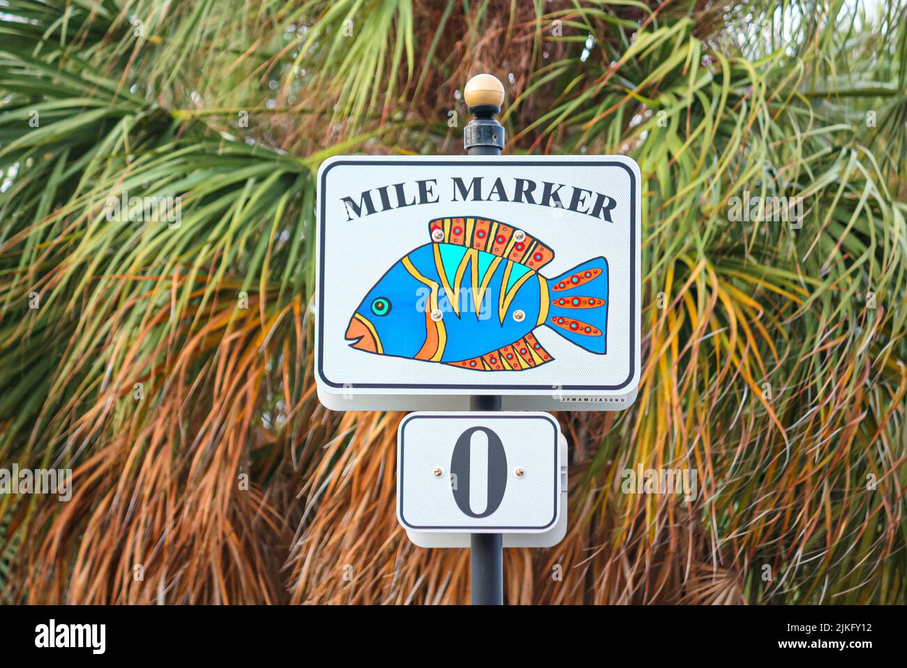 A closeup of a mile market sign with blue fish Stock Photo