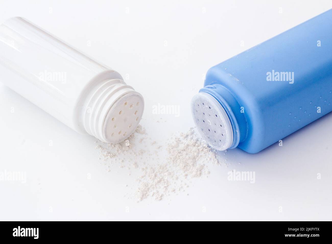 Talcum powder in container. Spilled white powder Stock Photo Alamy