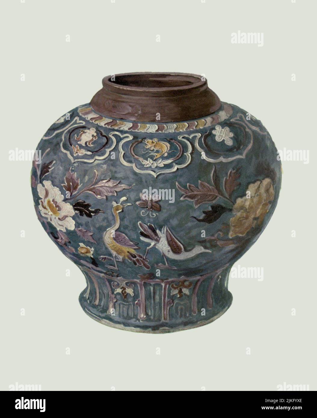 Jar, Chinese, early Ming dynasty, with decora tion in slightly raised outline filled in with coloured glazes, the rim fitted in Persia with a chased brass mount. Height, 12.5 in from ' A book of porcelain, fine examples in the Victoria and Albert museum ' by Bernard Rackham, and William Gibb,  Publication date 1910 Publisher London, A. & C. Black Stock Photo