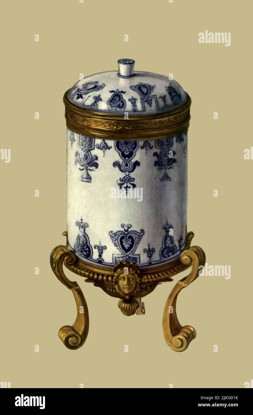 Toilette-pot and Cover, St. Cloud, about 1700, with ormolu mount of the period. Height, 8.5 in. from ' A book of porcelain, fine examples in the Victoria and Albert museum ' by Bernard Rackham, and William Gibb,  Publication date 1910 Publisher London, A. & C. Black Stock Photo