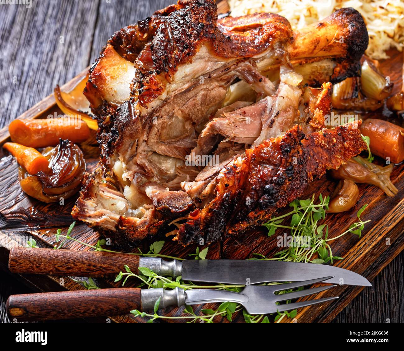 Crispy German Pork Knuckle, roast ham hock, Schweinshaxe, with Beer