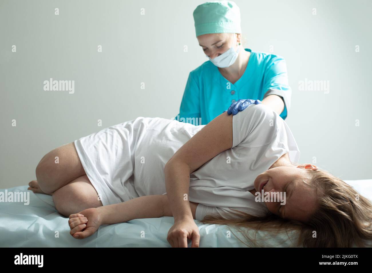 Doctor process epidural nerve block for pregnant woman Stock Photo