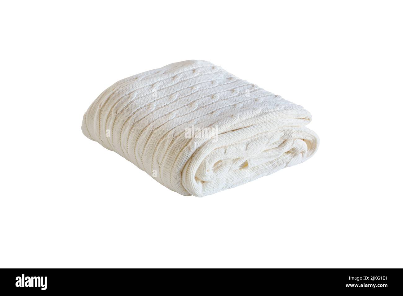 Warm white cable knit blanket folded neatly and isolated over a white background with clipping path. Stock Photo