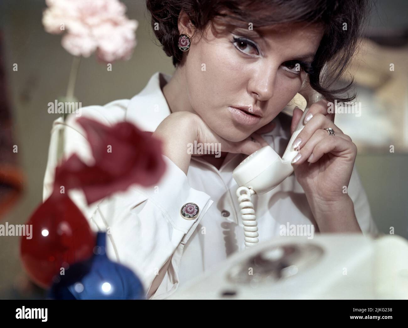 27.02.1975, German Democratic Republic, , Berlin - Woman talking on the phone. 00S750227D008CAROEX.JPG [MODEL RELEASE: NO, PROPERTY RELEASE: NO (c) ca Stock Photo