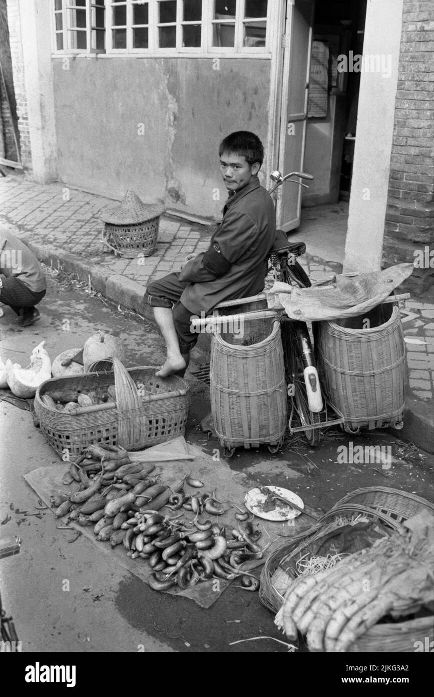 CHINA XIAN Young boy out at street selling food Stock Photo