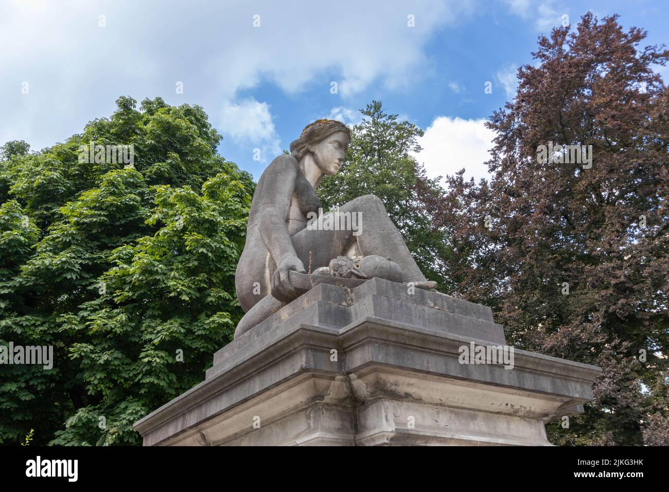 A statue of a sitting woman decorating the fence of the Cinquantenaire Park, Brussels, Belgium Stock Photo