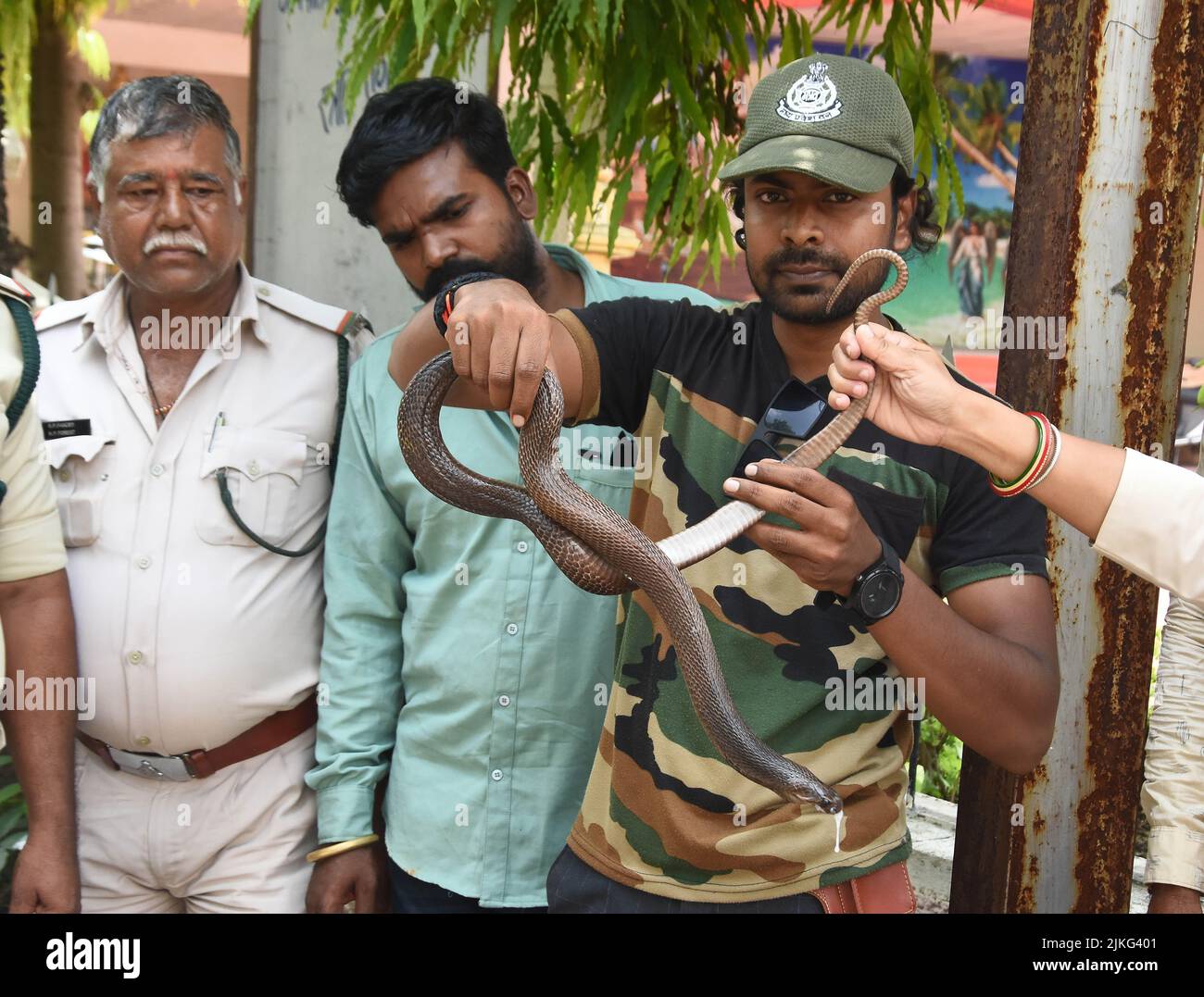 Wildlife expert Abhilash Varshney shows a Cobra snake for awareness on ...