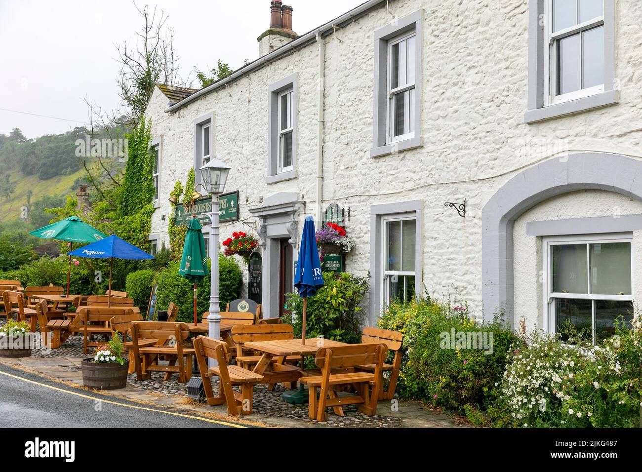 Kettlewell, village in the Yorkshire Dales used for film production and local pub the Racehorses Hotel with front beer garden,Yorkshire,England,summer Stock Photo