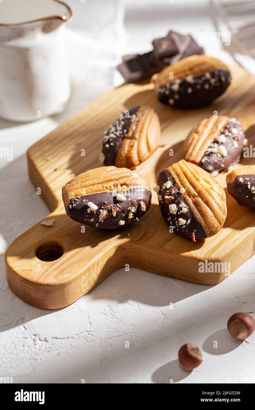 Vanilla madeleine cookies with chocolate and nuts Stock Photo Alamy