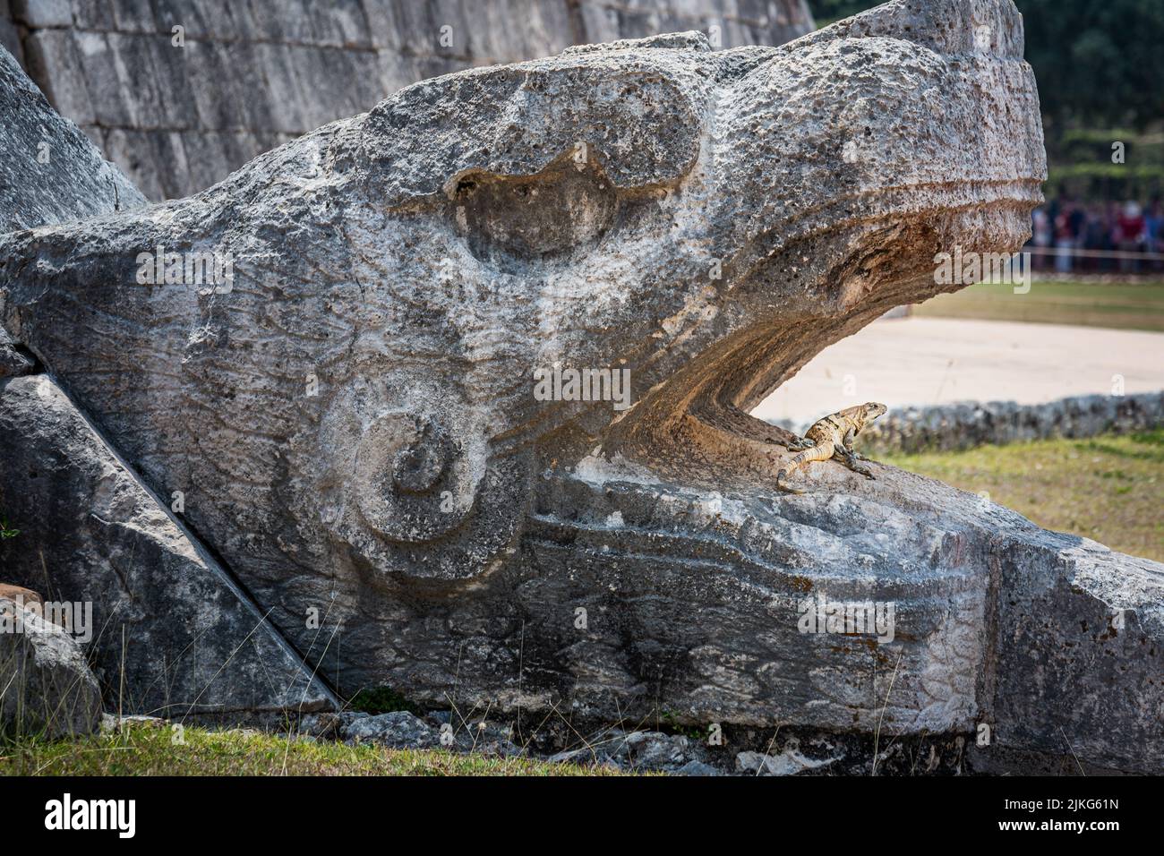 Chichen Itza kukulcan snake with lizard reptile in the open mouth, Mexico Stock Photo