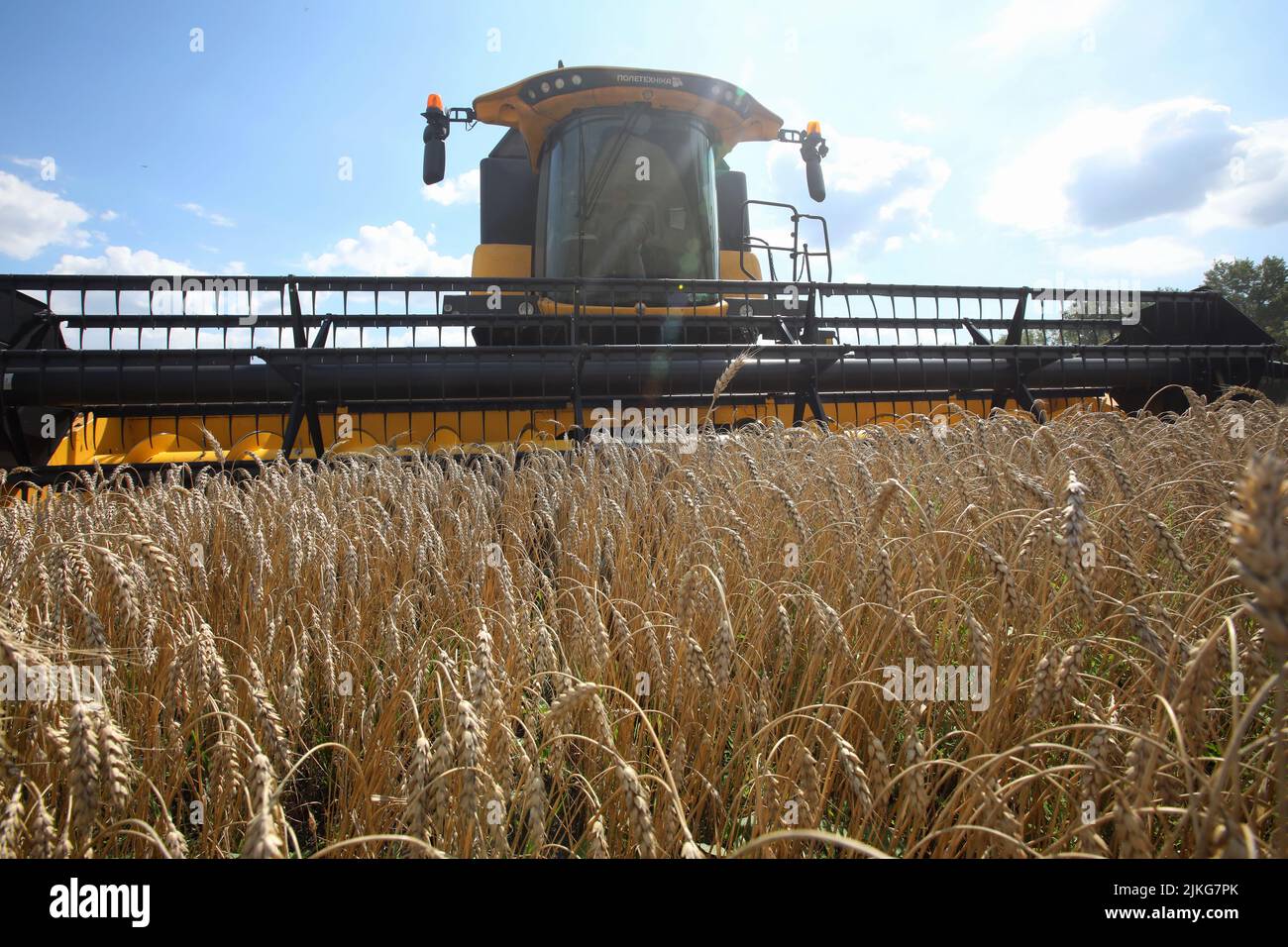 KHARKIV REGION, UKRAINE JULY 30, 2022 A combine harvester collects