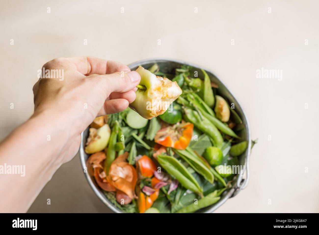 Throw organic waste into a compost bucket. Sorted organic kitchen waste