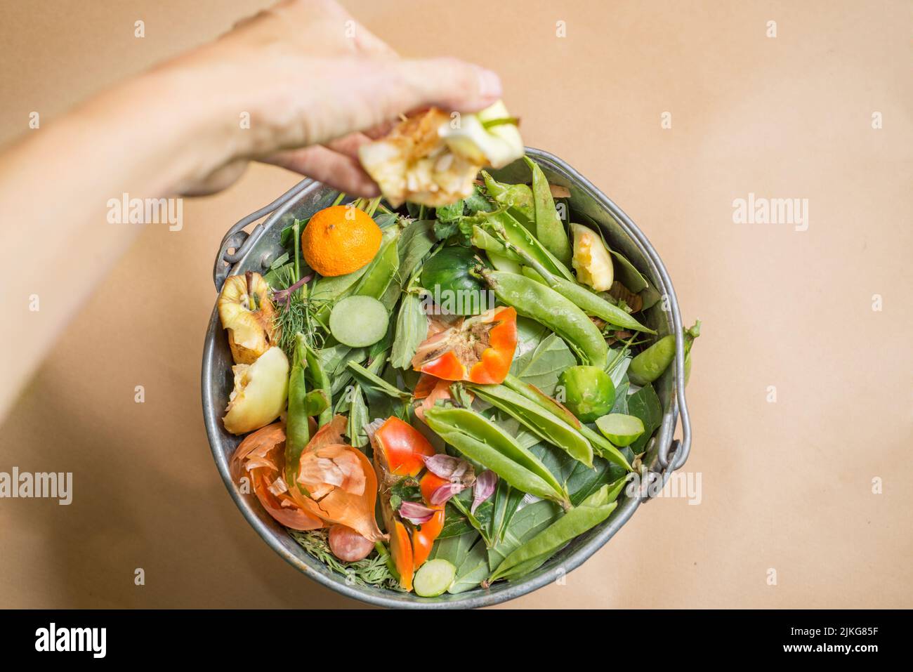 Throw organic waste into a compost bucket. Sorted organic kitchen waste