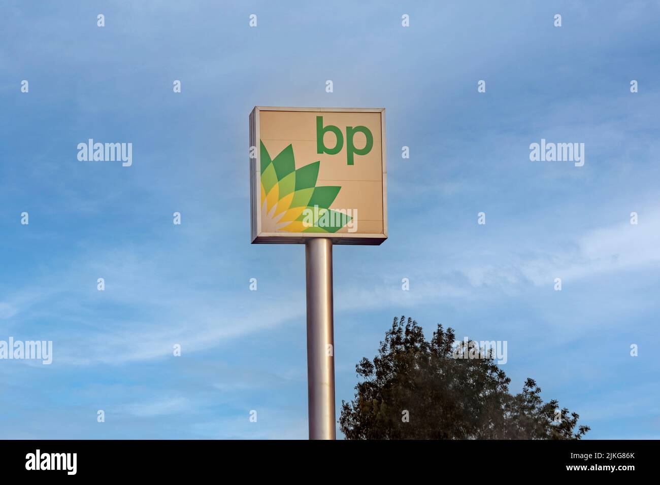 Lighted sign board with large British Petroleum, BP logo placed on a poll in the highway gas station. Stock Photo