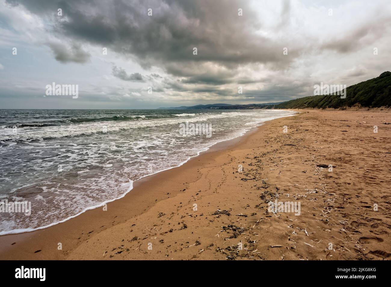 Surf waves with turquoise color and empty beach. Kiyikoy Town, Kirklareli of Black Sea, Turkey. Stock Photo